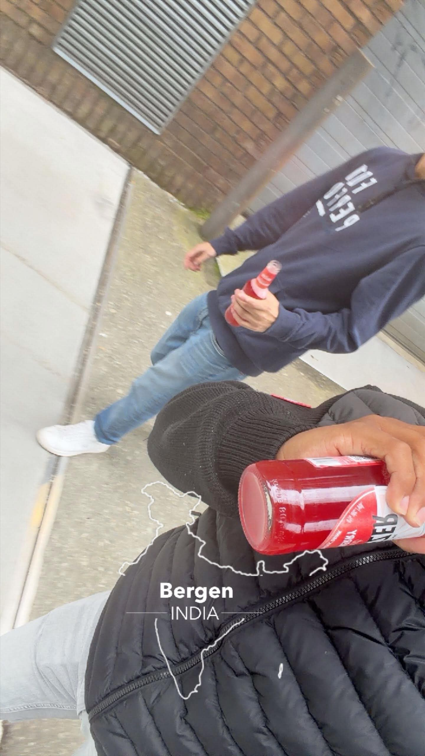 Friends sharing a red drink in Bergen